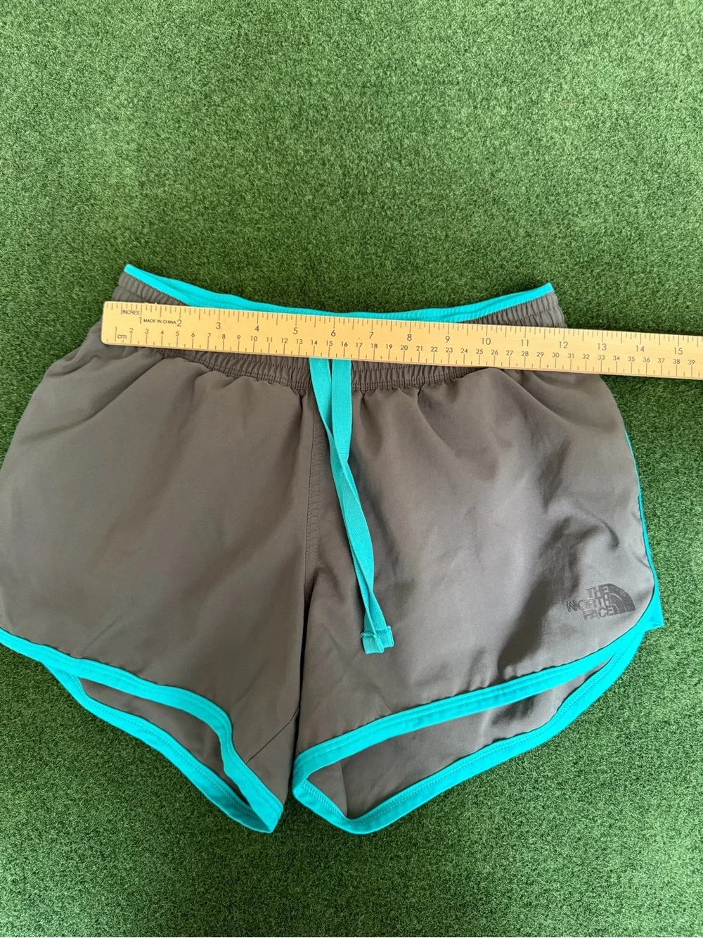 The North Face Women’s Gray Athletic Shorts with Teal Trim